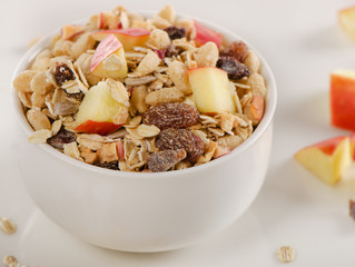 Healthy muesli breakfast with a apple
