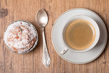 Top view on cup of coffee and muffin