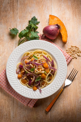 spaghetti with pumpkin onion and parsley