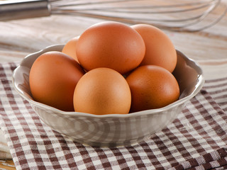 Fresh raw   brown eggs in a bowl