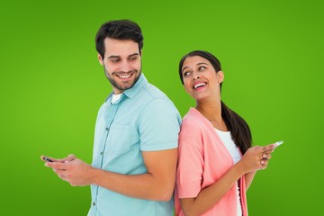 Composite image of happy couple sending text messages