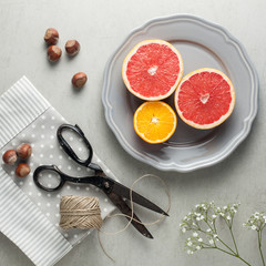 Obraz na płótnie Canvas citrus fruit and hazelnuts as snack