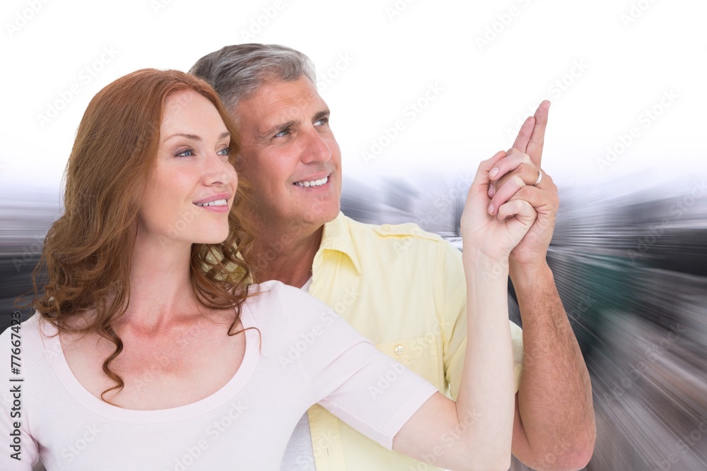 Poster Composite image of casual couple smiling and pointing