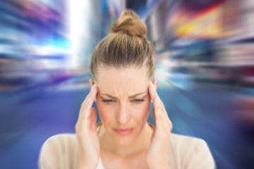 Composite image of woman with headache