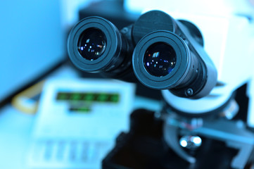 Fototapeta na wymiar microscope at the blood laboratory take with blue filter