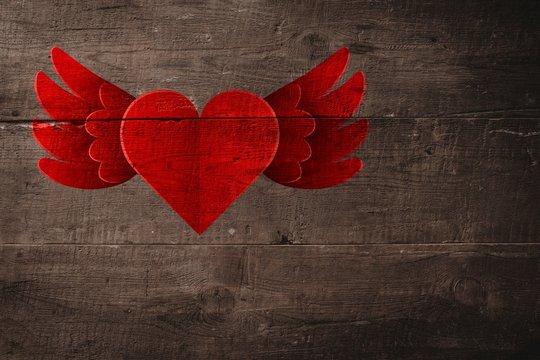 Composite image of heart with wings