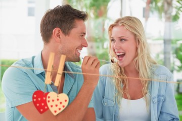 Composite image of hip young couple having desert together