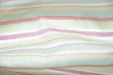 Closeup detail of green, red and white striped fabric