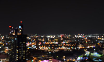 Blurred city lights bokeh illuminated at night