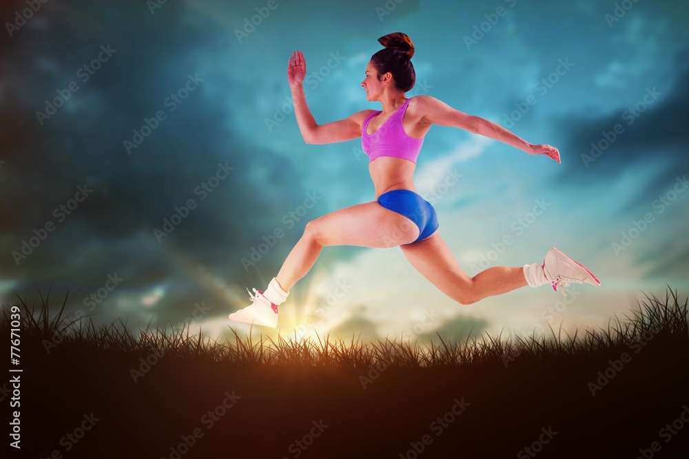 Poster Composite image of fit brunette running and jumping