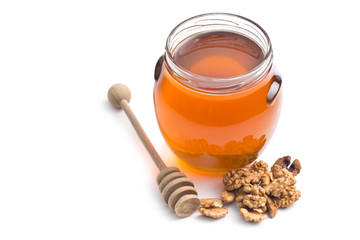 honey in a jar and walnuts
