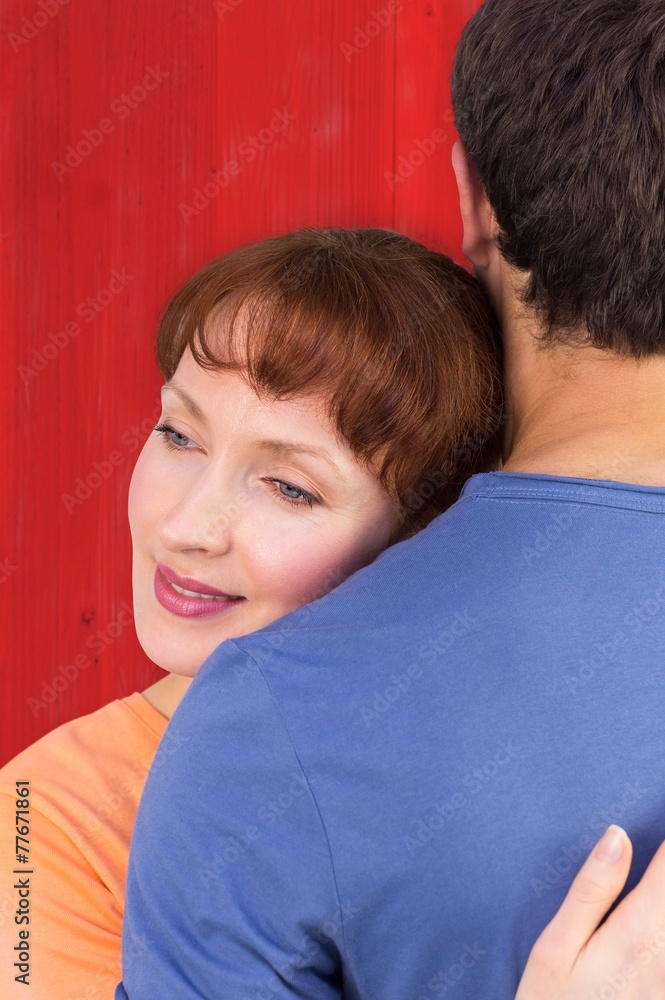 Aufkleber composite image of happy couple hugging one another