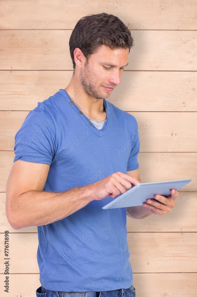 Aufkleber composite image of man scrolling through tablet pc