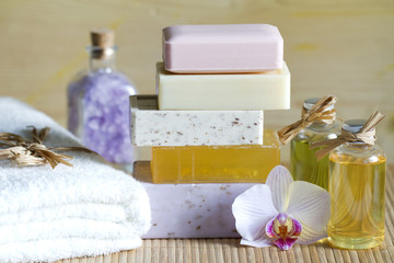 Pile of soaps with cosmetics for spa and body care