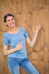 Composite image of pretty brunette playing air guitar