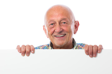 Senior man holds a blank board