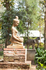 Woman clay doll decorated in garden