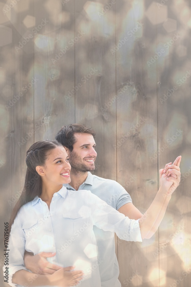 Poster composite image of cute couple embracing and pointing