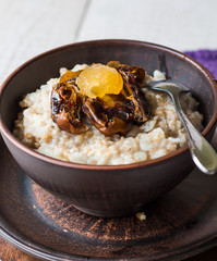 oatmeal with milk and honey and dried fruit, healthy breakfast