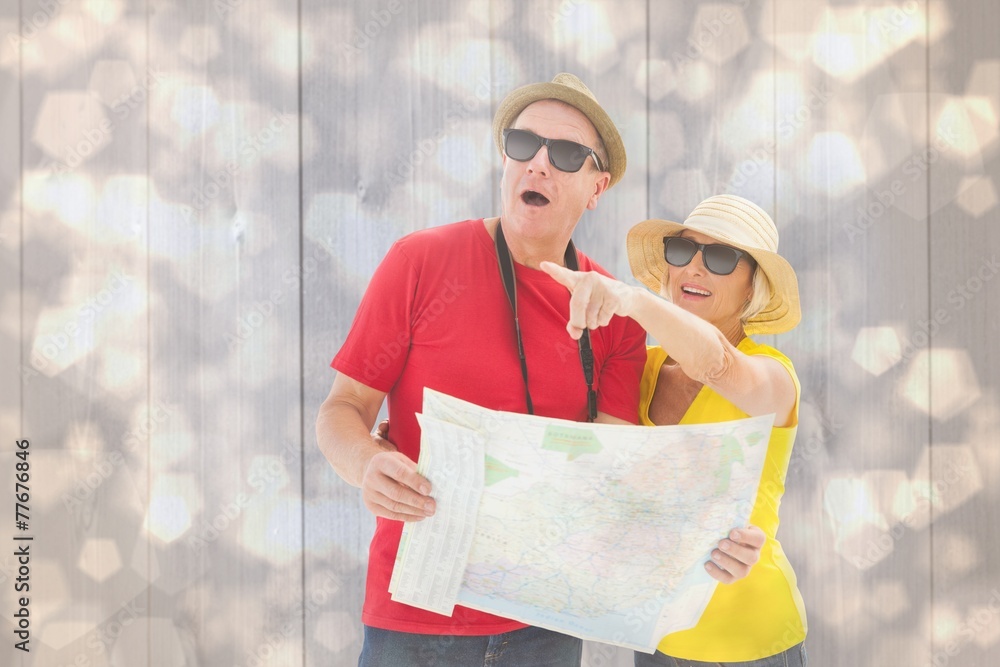 Aufkleber composite image of happy tourist couple using map
