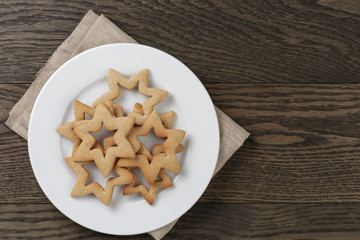 stars cookies for valentines day in plate on wood table