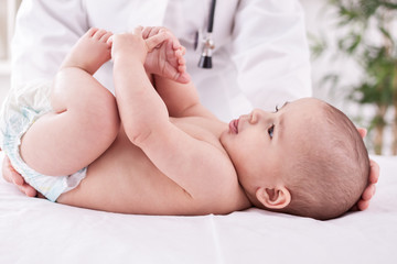 Female doctor pediatrician with baby patient
