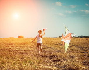 happy little girl with a kite