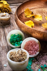 bronze bowl with water and accessories spa treatments