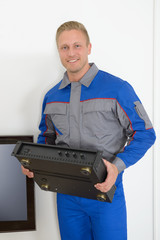 Technician Holding Amplifier