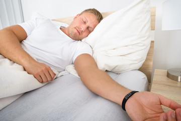 Man Sleeping Wearing Smart Wristband