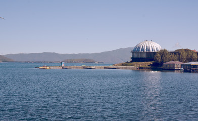 Obraz premium Sevan lake with houses, buildings and mountains