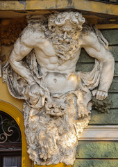 Fototapeta na wymiar Sculpture of Atlas on facade of Public Library in Subotica
