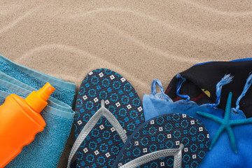 Accessories for the beach lying on the sand