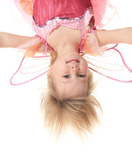 Little girl in butterfly costume on white background