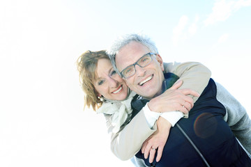 Portrait of happy senior couple in winter season