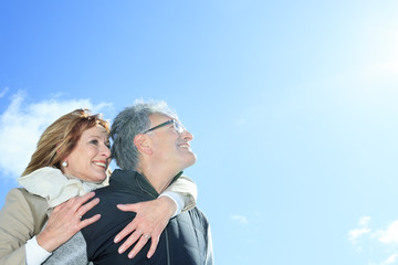 Portrait of happy senior couple in winter season