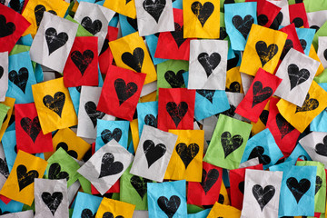 Сrumpled сolorful pieces of paper with hearts