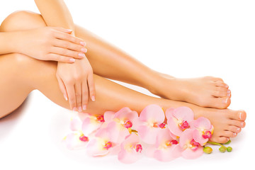 manicure and pedicure with a pink orchid flower