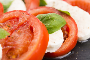 Caprese salad with mozzarella, tomato, basil and balsamic vinega