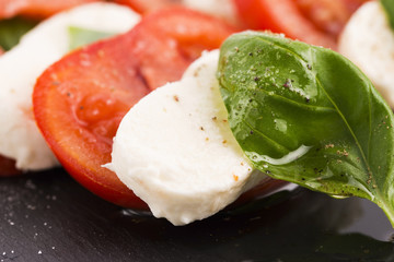 Caprese salad with mozzarella, tomato, basil and balsamic vinega