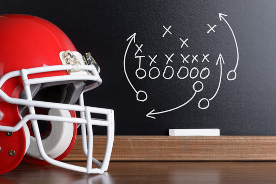 Football Play Strategy Drawn Out On A Chalk Board - Powered by Adobe