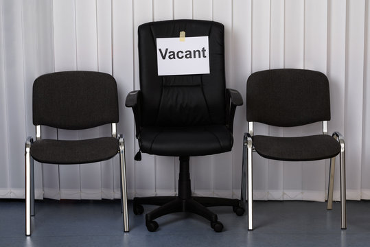 Office Chair With A Vacant Sign