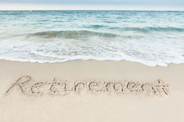 Tuinposter Retirement Written On Sand By Sea © Andrey Popov