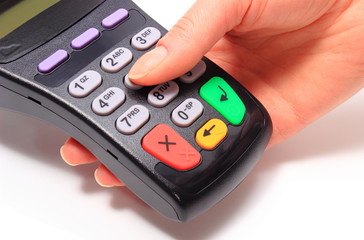 Obraz premium Using payment terminal, enter personal identification number