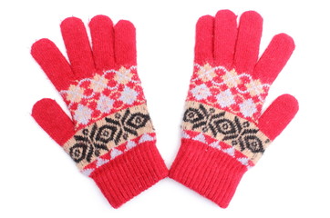 Pair of red woolen gloves on white background