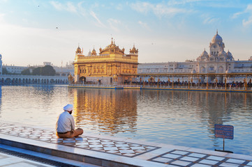 Sikh man is praying in Golden Temple. Amritsar. India