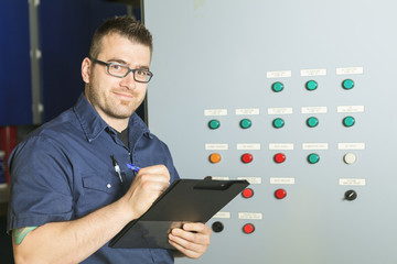 Portrait of an happy worker in a factory