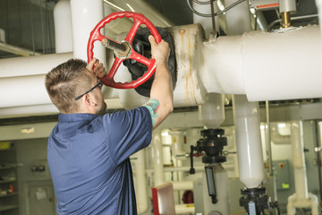 A good serviceman working on a machine room