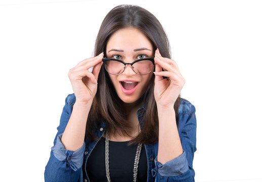 surprised girl looking over glasses