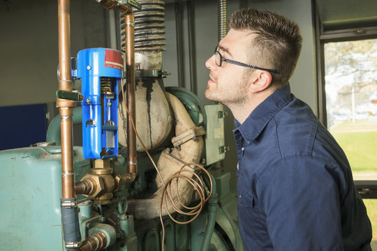 A good serviceman working on a machine room
